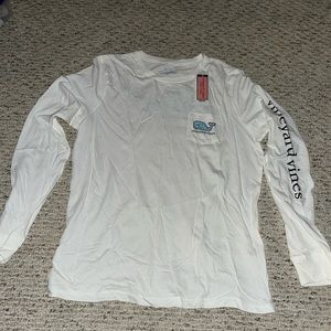 In your vines, white long sleeve shirt with blue writing size medium